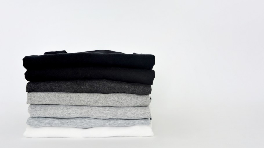 stack of black and grey T-shirts