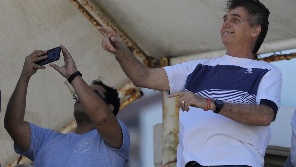 Brazil's President-elect Jair Bolsonaro watches a aerial performance by the private pilots' group "Esquadrilha do Ceu" or "Sky Squadron", at Barra beach in Rio de Janeiro, Brazil, . Bolsonaro appeared in public Tuesday for the first time as president-elect. He visited a church led by ultraconservative pastor Silas Malafaia and spoke briefly to the faithful on stage. "I am sure that I am not the most capable, but God capacitates the chosen ones," he saidBolsonaro, Rio de Janeiro, Brazil - 31 Oct 2018