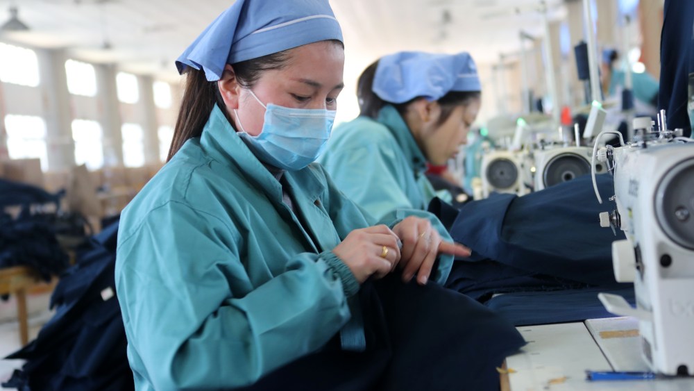 --FILE--Female Chinese workers sew clothes to be exported to Europe and the United States at a garment factory in Huaibei city, east China's Anhui province, 27 March 2017.China's exports in yuan-denominated terms rose 14.8 percent year on year in the first quarter, while imports increased 31.1 percent, customs data showed Thursday (13 April 2017). Foreign trade volume reached 6.2 trillion yuan (about 902.47 billion U.S. dollars) in the first quarter, up 21.8 percent year on year.