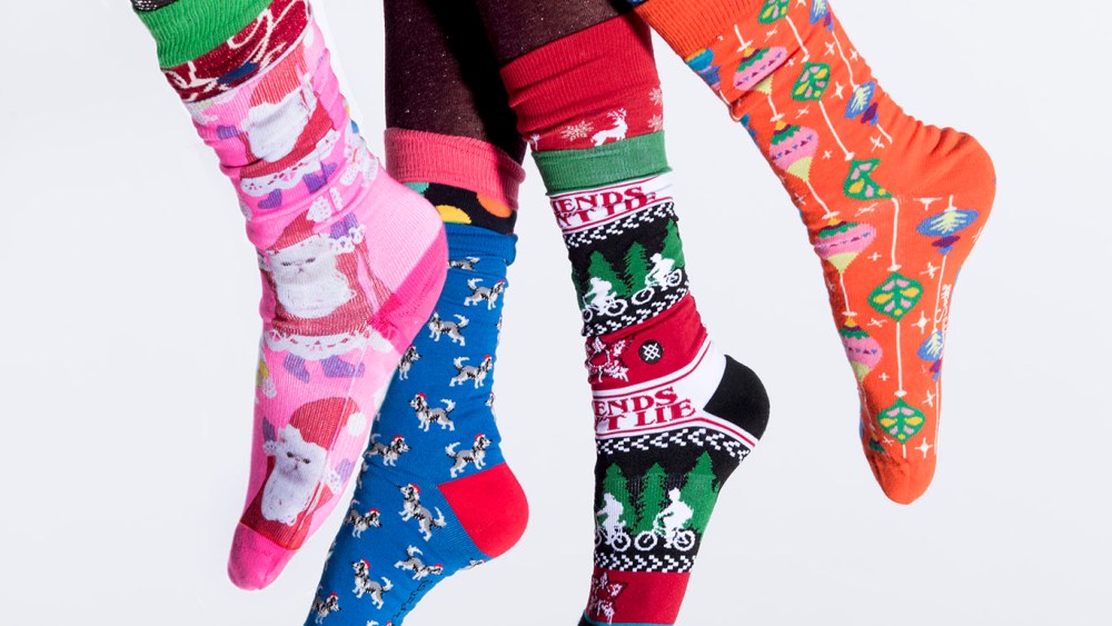 From left: Happy Socks’ sock under Stance’s santa cat sock; Happy Socks’ socks; Express’ sock under Stance’s sock; Happy Socks’ socks, and Calzedonia tights (worn under throughout).