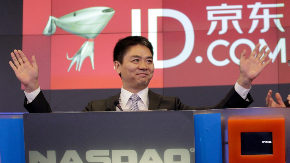Qiangdong Liu, CEO of JD.com, raises his armsprior to the opening of the Nasdaq market, in New York. JD.com, China's No. 2 e-commerce service, is headquartered in BeijingWall Street IPO JD.com, New York, USA