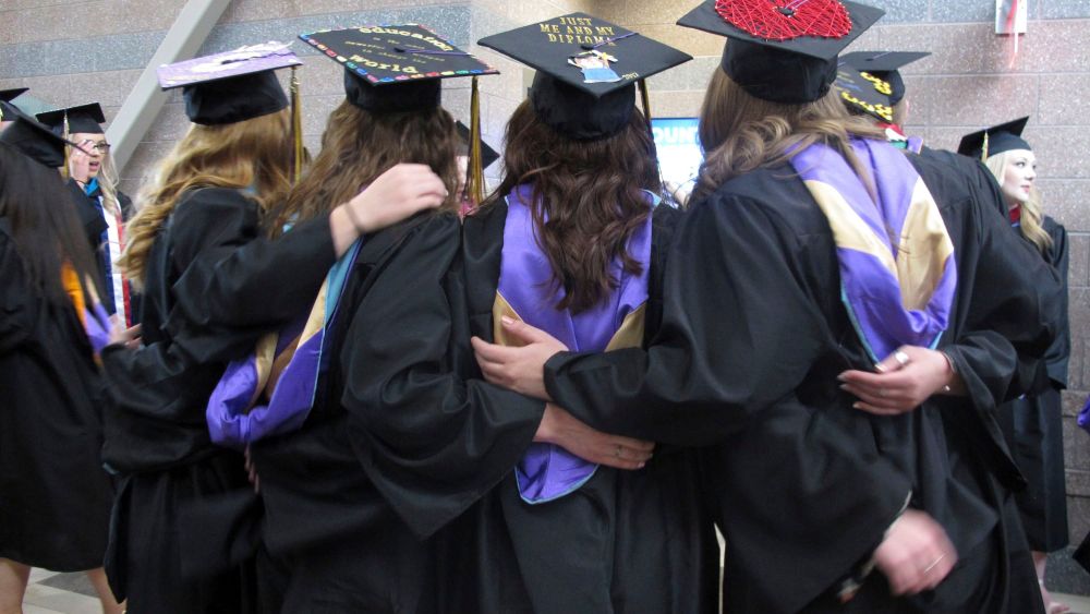 Carroll College students pose for a photo before their graduation ceremony in Helena, Mont. With a week to go before the May 25 special congressional election, Democrat Rob Quist is hoping his outreach to college students will pay off at the ballot box. The college vote is an important part of Quist's get-out-the-vote strategy against Republican Greg Gianforte and Libertarian Mark Wicks to fill the seat vacated by Ryan Zinke when he became President Donald Trump's Interior secretaryMontana Special Election College Voters, Helena, USA - 13 May 2017