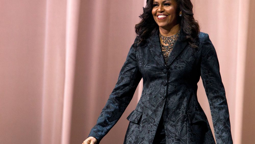 Former first lady Michelle Obama walks on stage during a stop on her book tour for "Becoming," in WashingtonMichelle Obama Book Tour, Washington, USA - 25 Nov 2018