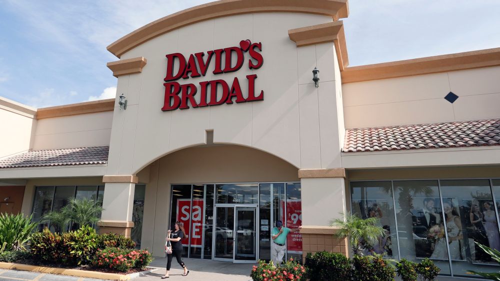 The entrance to a David's Bridal store is seen, in Orlando, Fla. David's Bridal is filing for bankruptcy protection but there is no danger for customers who have ordered dresses because operations are continuing as normal while the wedding and prom retailer restructuresDavids Bridal Bankruptcy, Orlando, USA - 19 Nov 2018