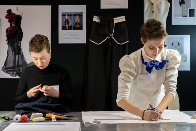 Two apprenticeship students at the Ecole de la Chambre Syndicale de la couture booth at the IME fair