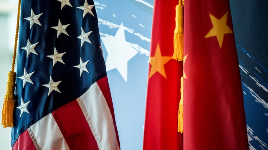 The Chinese and US national flags are seen during a promotional event in Beijing