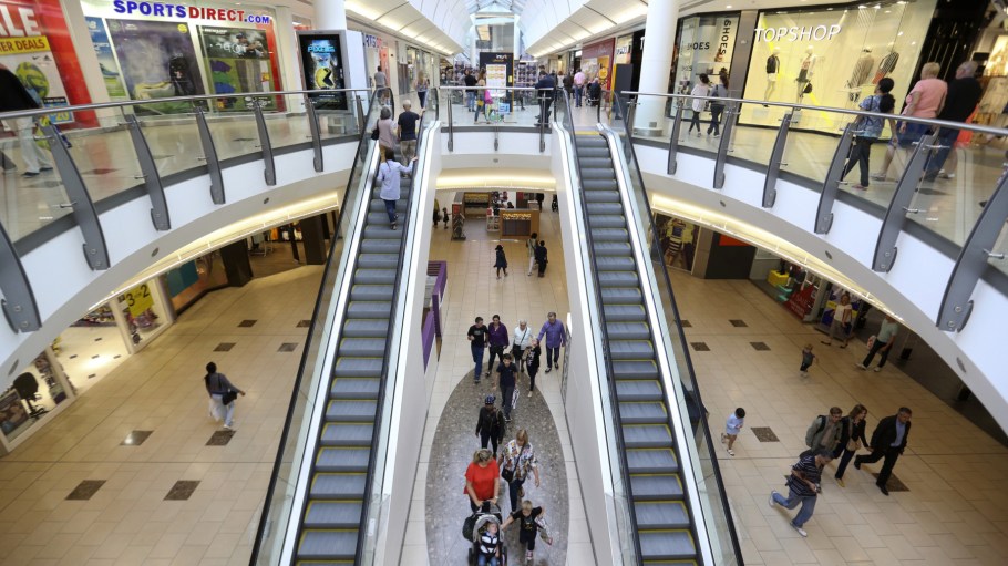 Shoppers pass through Lakeside shopping centre, operated by Intu Properties Plc., in Thurrock, U.K