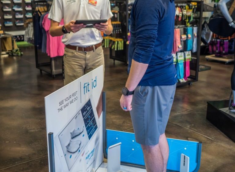 Image of man getting scanned by Fit ID at Fleet Feet