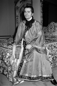 Karl Lagerfeld sitting on his bed at home, 1978.