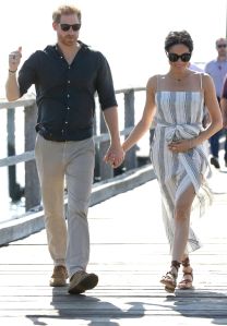 Harry, Meghan. Britain's Prince Harry, left, and Meghan, Duchess of Sussex walk along Kingfisher Bay Jetty during a visit to Fraser Island, Australia, . Prince Harry and his wife Meghan are on day seven of their 16-day tour of Australia and the South PacificBritain Royals, Fraser Island, Australia - 22 Oct 2018WEARING REFORMATION SHOES BY SARAH FLINT