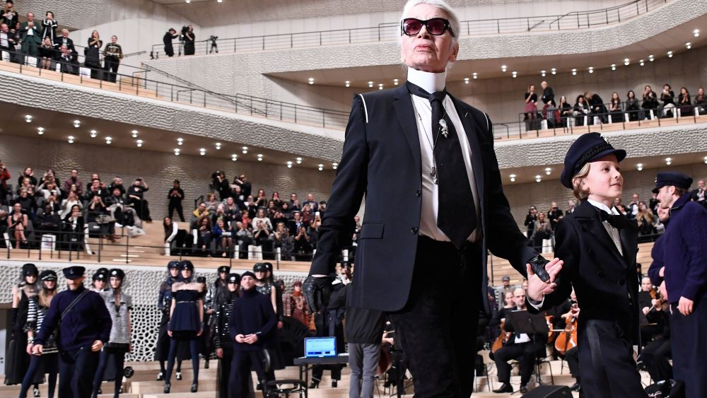 Karl Lagerfeld and Hudson Kroenig on the catwalk at the Chanel Metiers d'Art show in Hamburg