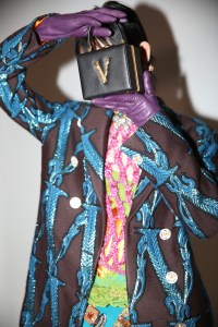If maxi is booming, mini, or micro, is keeping up. Donatella Versace embellished a structured tiny handbag with a metallic VÉ the power of logo.