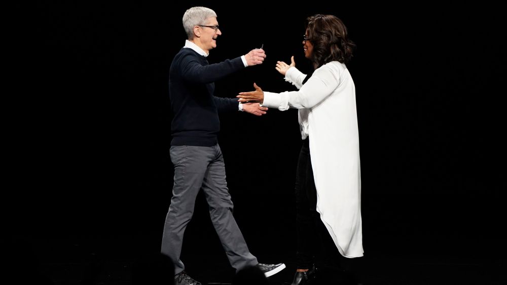 Apple CEO Tim Cook and Oprah Winfrey prepare to embrace at the Steve Jobs Theater during an event to announce new products, in Cupertino, CalifApple Streaming TV, Cupertino, USA - 25 Mar 2019