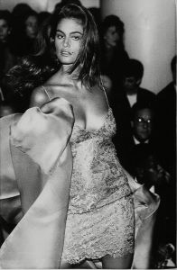 Cindy Crawford Model Cindy Crawford wears an outfit by designer Calvin Klein at a showing for spring and summer in New York, . An unadorned slip dress that comes to life with a sumptuous off-the-shoulder coat or wrap is Klein's sensuous creation for the seasonFashion Crawford, New York, USA