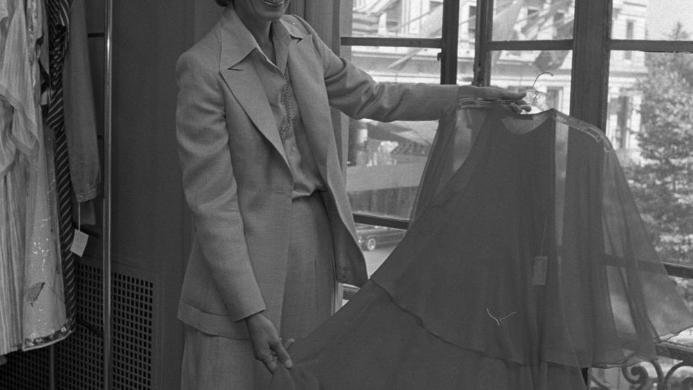 Dawn Mello holding a dress with sheer covering from 1975.