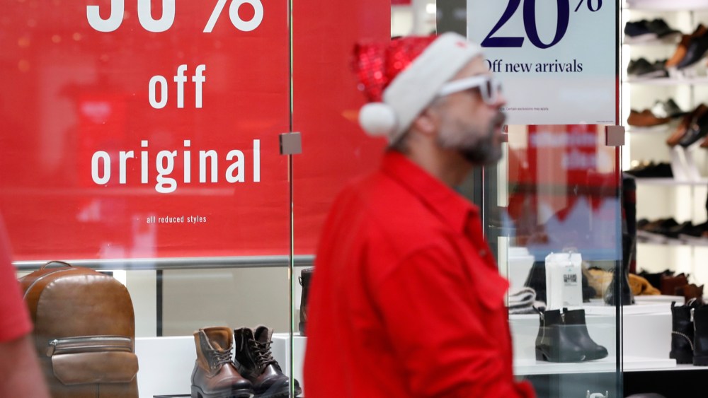 Chrry Creek Mall, discounts, Cherry Creek Mall. Discount placards stand in the window of a shoe store as last-minute shoppers finish up their Christmas gift lists at the Cherry Creek Mall, in Denver. Retailers were offering ample discounts plus even more price cuts to those shoppers who ventured out with the holiday loomingChristmas Shoppers, Denver, USA - 24 Dec 2018