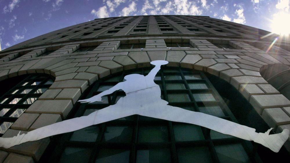 A Michael Jordan logo reflects off of Niketown in Portland, Ore. A photographer has accused Nike of violating the copyright of his 1984 image of a soaring Michael Jordan, which he alleges the company later misused to create the profitable "Jumpman Logo." The lawsuit, filed in federal court in Portland,, seeks unspecified monetary damages based on profits attributable to the infringement on the copyrightNike Lawsuit-Jordan Copyright, Portland, USA