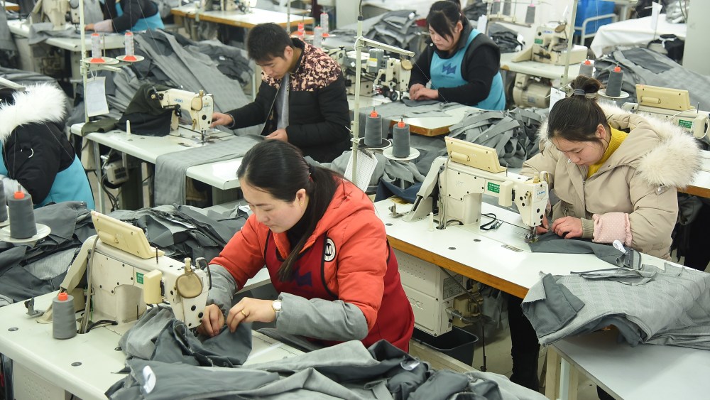 Workers at a clothes manufacturing factory in Lianyungang, Jiangsu ProvinceWorkers at a clothes manufacturing factory, China - 13 Feb 2019