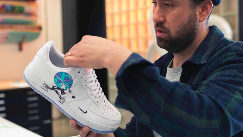 Artist Steven Harrington working on his Nike Earth Day caspule.