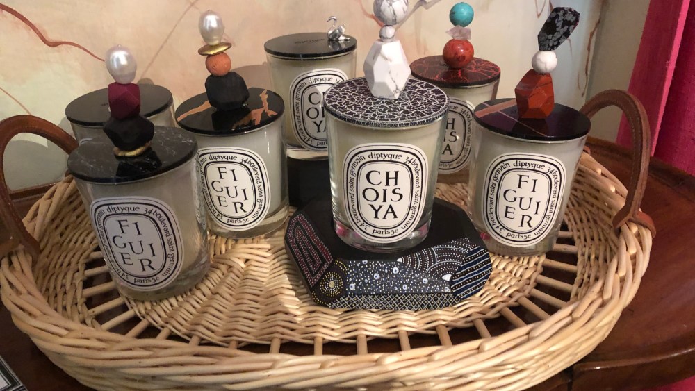 Diptyque candles and decorative lids by Jean Baptiste Mayet.
