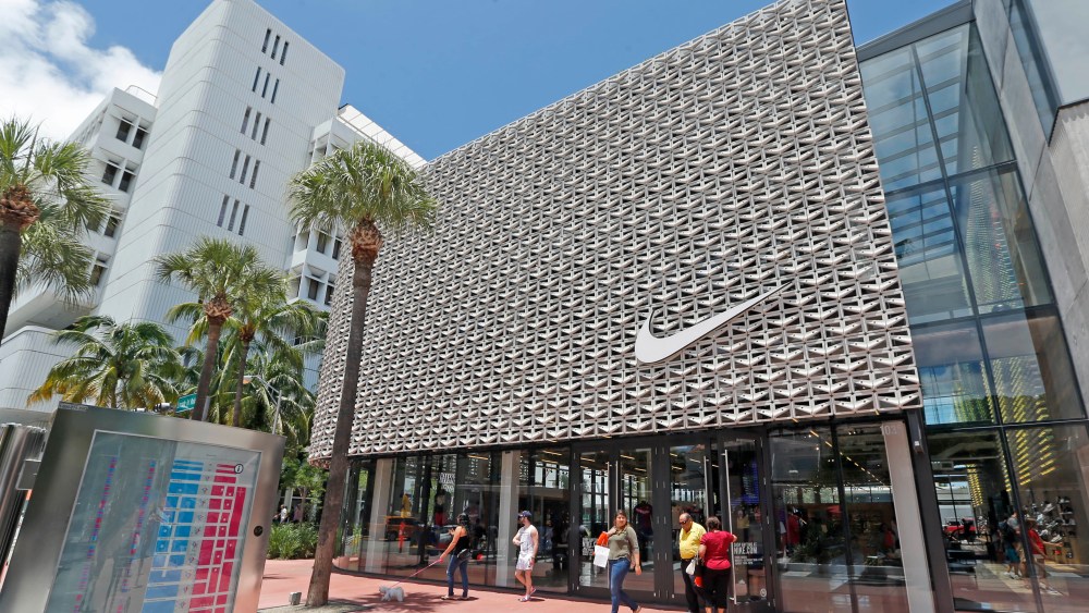 Shoppers walk out of a Nike store in Miami Beach, Fla. Nike Inc. reports earnings, Tuesday, Sept. 26, 2017Earns Nike, Miami Beach, USA - 08 Aug 2017
