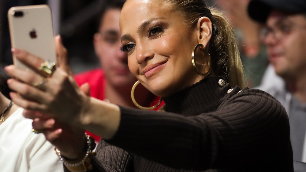 American singer and actress, Jennifer Lopez, also known by her nickname J.Lo, takes a selfie during the second half of the NCAA men's basketball game between the Duke Blue Devils and the University of Miami Hurricanes at the Watsco Center in Coral Gables, Florida. Duke won 83-75NCAA Basketball Duke vs Miami, Coral Gables, USA - 15 Jan 2018