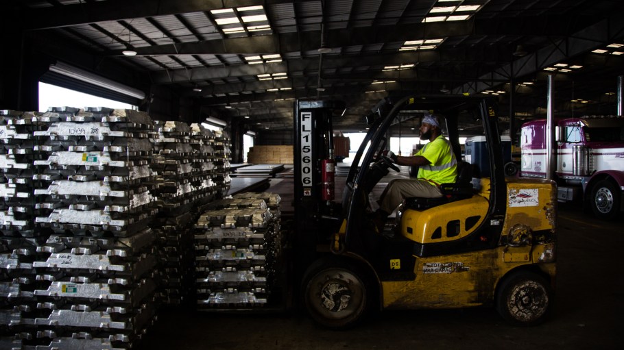 A worker uses a forklift to move aluminum ingots in a warehouse at the Port of New Orleans in New Orleans, Louisiana, U.S., on Tuesday, Sept. 18, 2018.