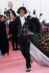 Ezra Miller Ñ Genuinely provocative painted eyes and Burberry pinstripes.