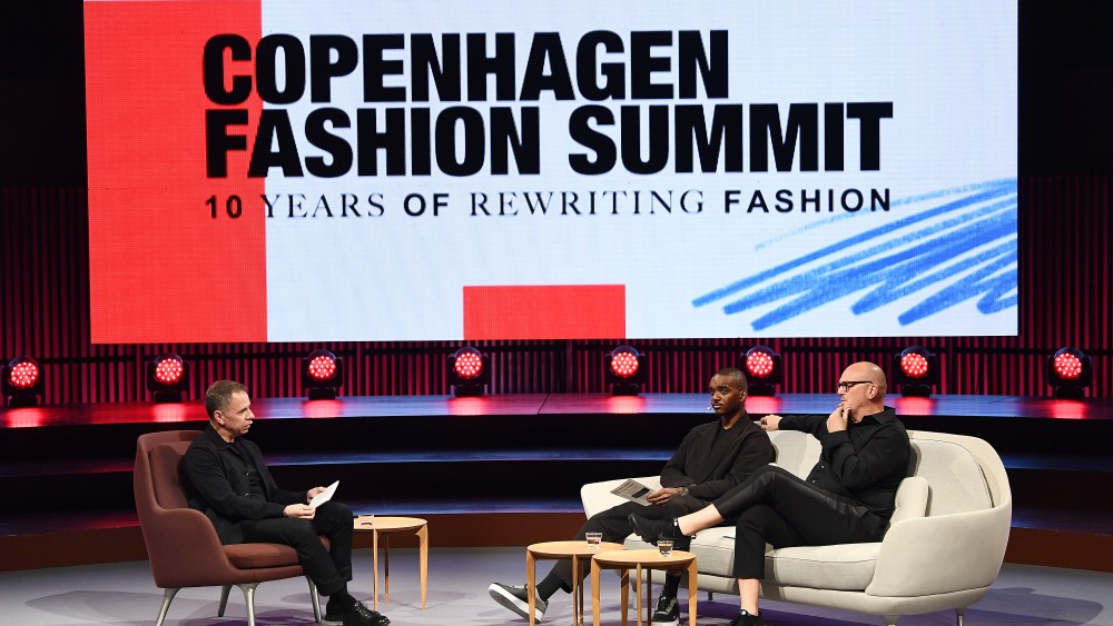 Miles Socha, Editor in Chief, WWD, Samuel Ross, Founder and Designer, A-Cold-Wall, and John Hoke, Chief Design Officer, Nike, in a panel discussion at Copenhagen Fashion Summit