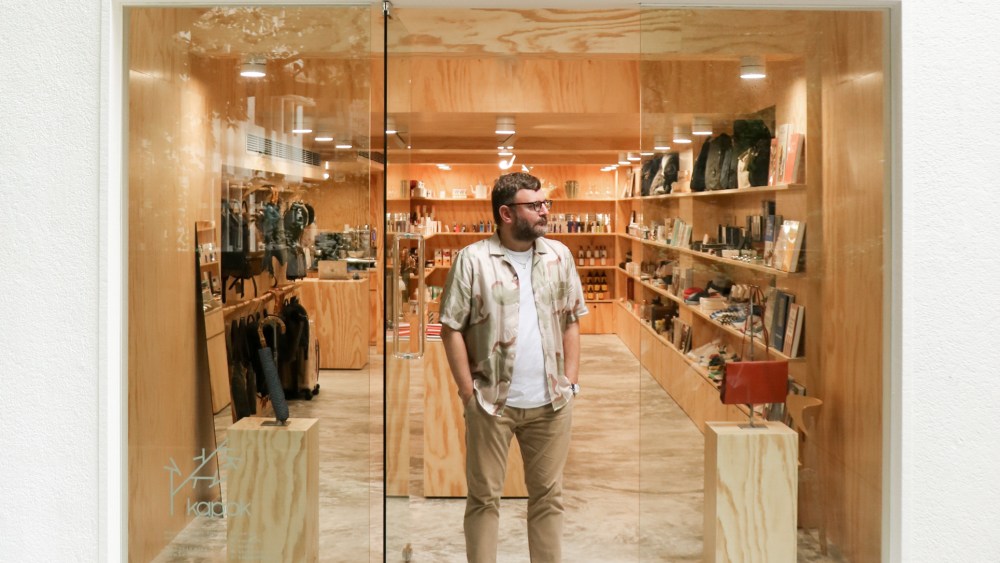 Castel stands in front of the new Kapok store.