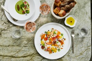 Burrata with stone fruit and heirloom tomatoes.