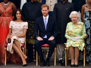 Britain's Queen Elizabeth II, Prince Harry and Meghan Duchess of Sussex pose for a group photo at the Queen's Young Leaders Awards Ceremony at Buckingham Palace in LondonBritain Awards, London, United Kingdom - 26 Jun 2018