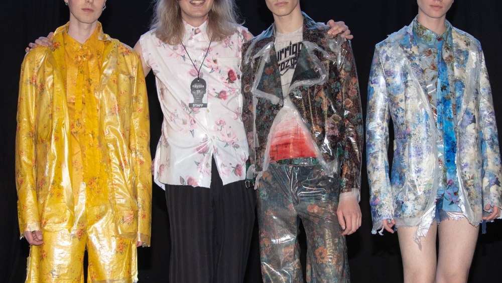 Diesel Award winner Justus Kantakoski posing with models sporting his collection.