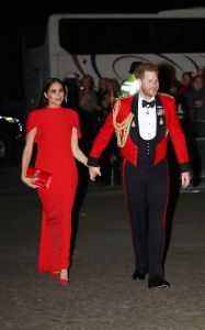 Britain's Prince Harry and Meghan, Duchess of Sussex arrive at the Royal Albert Hall in London, Saturday March 7, 2020, to attend the Mountbatten Festival of Music. (Simon Dawson/Pool via AP)