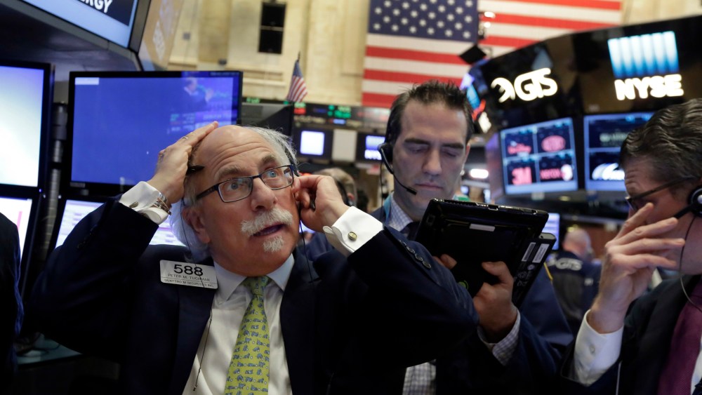 Peter Tuchman Trader Peter Tuchman, left, adjusts his headphone as he works on the floor of the New York Stock Exchange, . Stocks are opening higher on Wall Street as traders are encouraged by talk of more deals and some better news on retail earningsFinancial Markets Wall Street, New York, USA