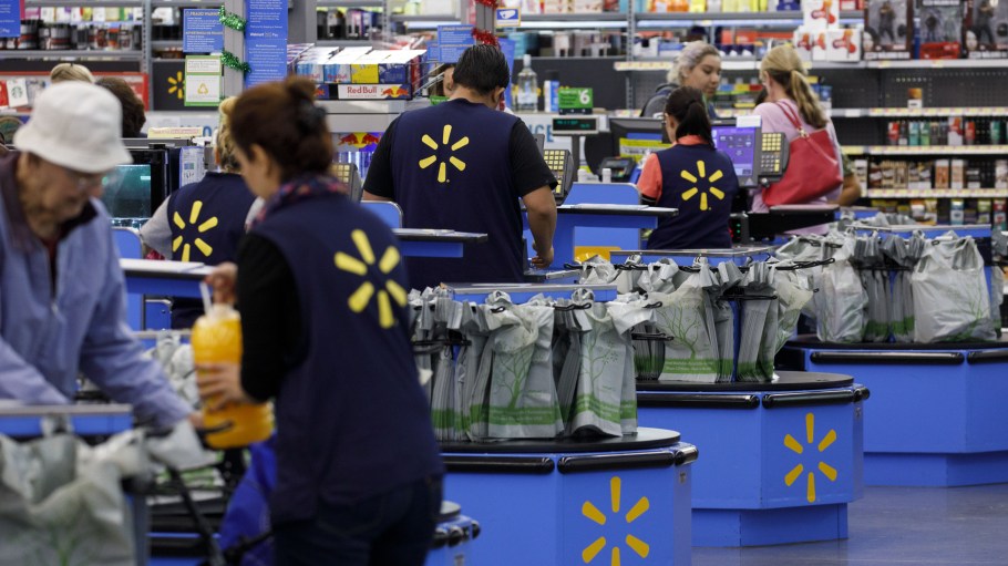 Cashiers ring up shoppers at a Walmart Inc. store in Burbank, California.