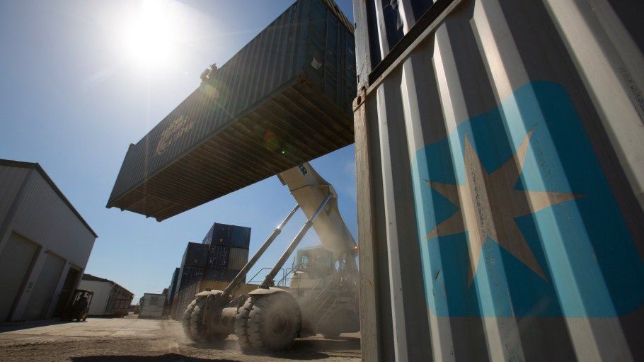 A reach stacker drives past an AP Moller-Maersk A/S branded shipping container in a storage area at the Freight Village Vorsino transport and logistics center operated by TransContainer PJSC in Kaluga, Russia, on Monday, April 9, 2018. Russias currency extended its plunge, dropping to the weakest level since Dec. 2016, as investors weighed the implications of the toughest U.S. sanctions yet.