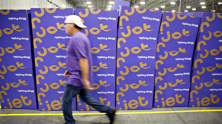 An employee walks past a stack of empty boxes at the Jet.com Inc. fulfillment center on Cyber Monday in Kansas City, Kansas, U.S.