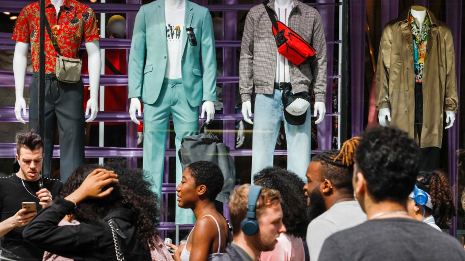 Shoppers pass TopShop retail store, operated by Arcadia Group Ltd., on Oxford Street in central London.