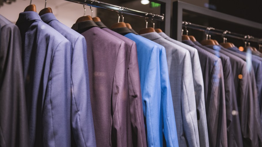 Rack of men's suits in a store