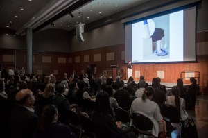 Eree Kim, one of the top four finalists and founder of HOPP, a shoe company, presents in front of the judges and crowd at the Fashion Institute of Technology.