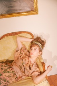 Red ValentinoÕs silk dress. Simone Rocha tiara; Miu Miu mary janes.