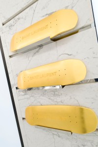 Gold skateboards at the Saint Laurent Rive Droite store.