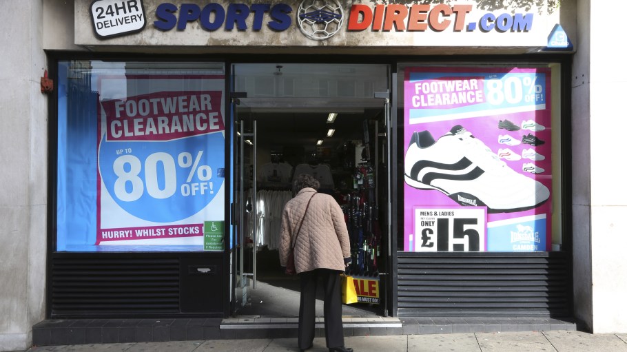 A pedestrian looks inside a Sports Direct International Plc store in London, U.K.