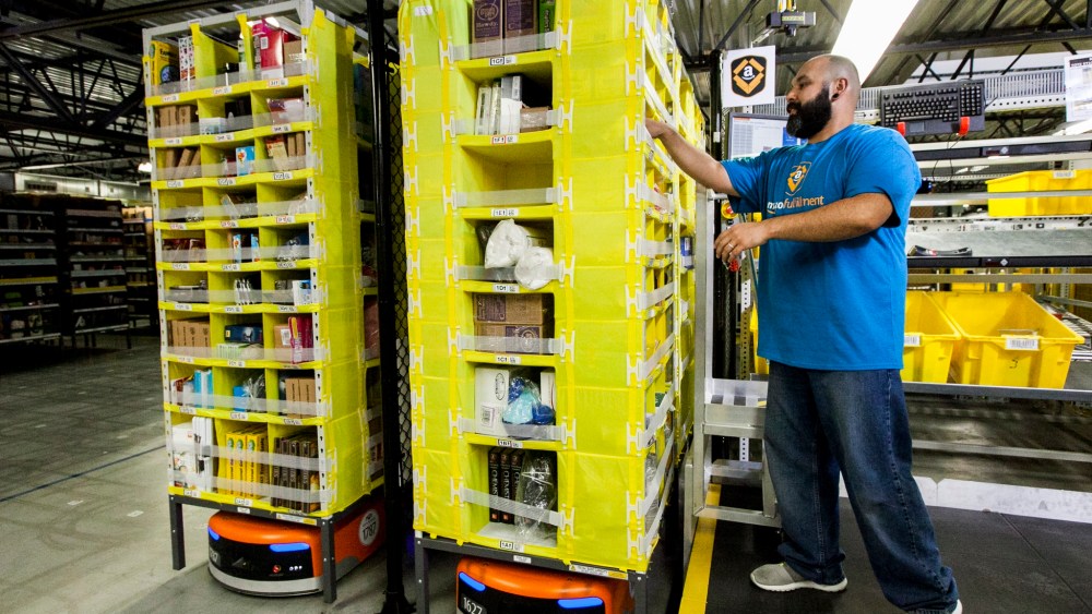 An employee picking with Amazon robotics.