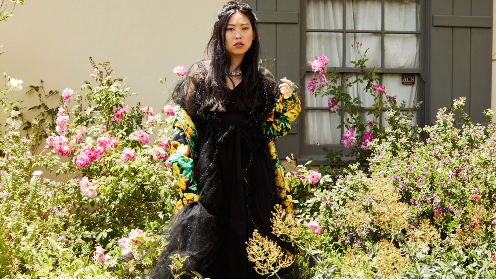 Valentino’s polyamide dress and viscose and elastane slip, available at Saks Fifth Avenue, under Richard Quinn’s polyester coat, available at Bergdorf Goodman. Alexander McQueen necklace.