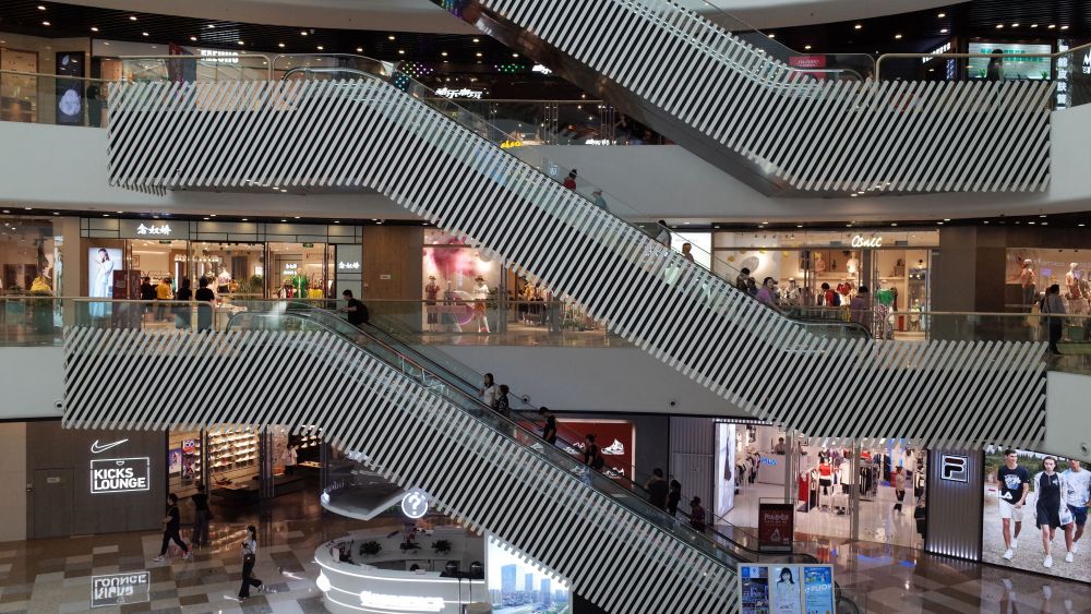 Chinese consumers walk at a shopping mall in Beijing, China, 28 May 2019. According to media reports, middle-class citizens are expressing their concerns over how the China-US trade war will affect their lives as food prices and business costs continue to rise.China-US trade war affects middle class in China, Beijing - 28 May 2019