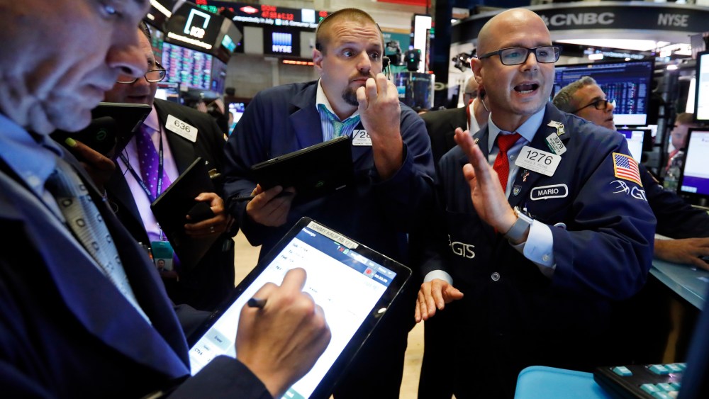 Specialist Mario Picone, right, works with traders at his post on the floor of the New York Stock Exchange, . U.S. stocks moved broadly lower in early trading on Wall Street Tuesday as President Donald Trump ramped up criticism of China just as negotiators began a new round of trade talksFinancial Markets Wall Street, New York, USA - 30 Jul 2019