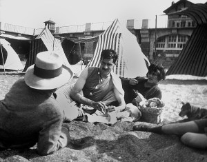 UNSPECIFIED - APRIL 01:  Coco Chanel and her lover Arthur " Boy " Capel (mustache) with Constent Say on the beach in Saint Jean de Luz in 1917  (Photo by Apic/Getty Images)