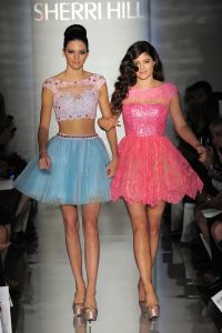 Kendall Jenner (L) and Kylie Jenner on the runway at Evening Sherri Hill's spring 2013 show at Trump Tower.Evening Sherri Hill Spring 2013 RTW, New York